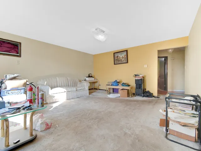 a bedroom with furniture and a wooden floor