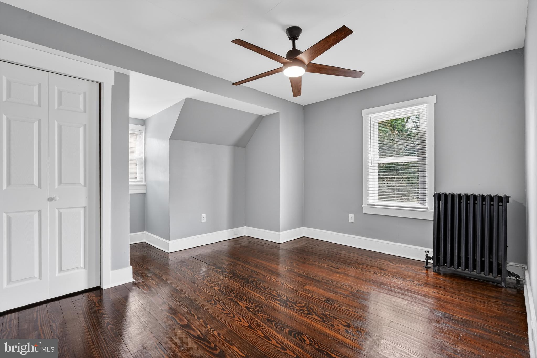 223 Noreg Place Brooklawn, NJ 08030 - Photo 25 of 36 an empty room with wooden floor and windows