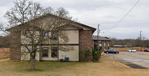 a view of multiple houses with yard