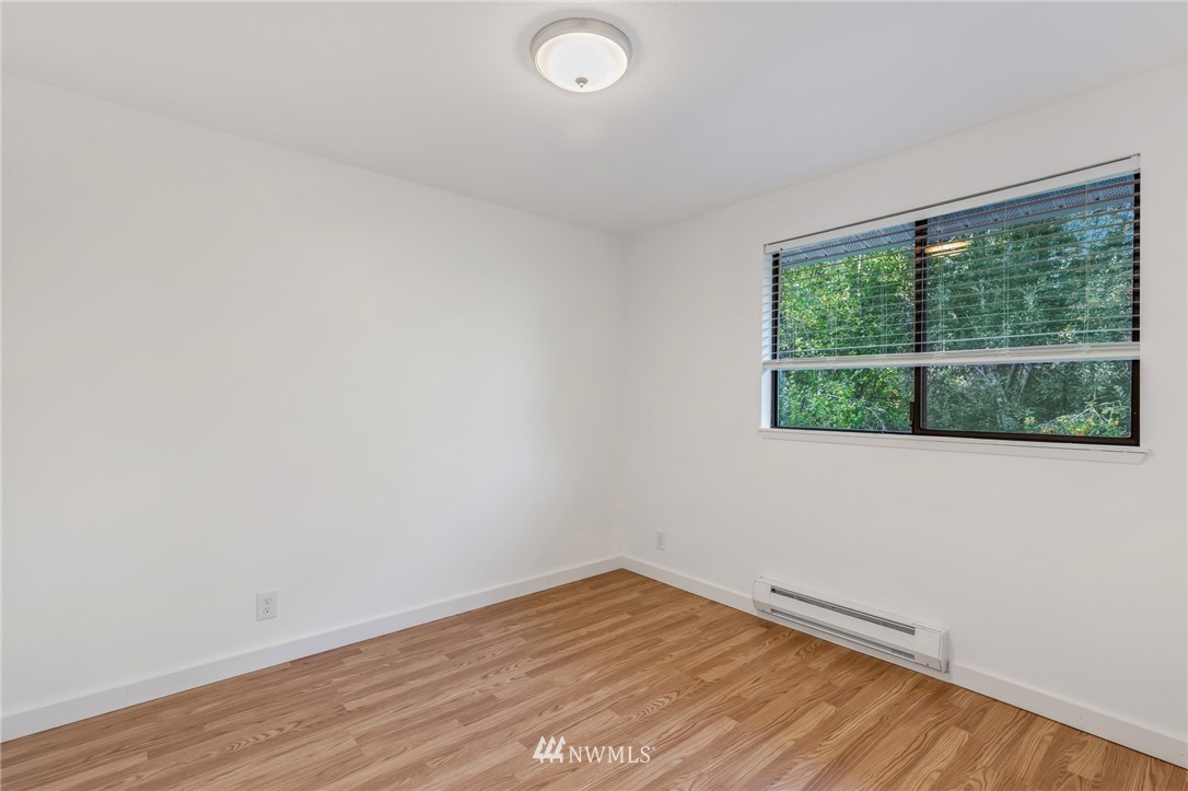 20512 Filbert Drive Bothell, WA 98012 - Photo 17 of 27 an empty room with wooden floor and windows