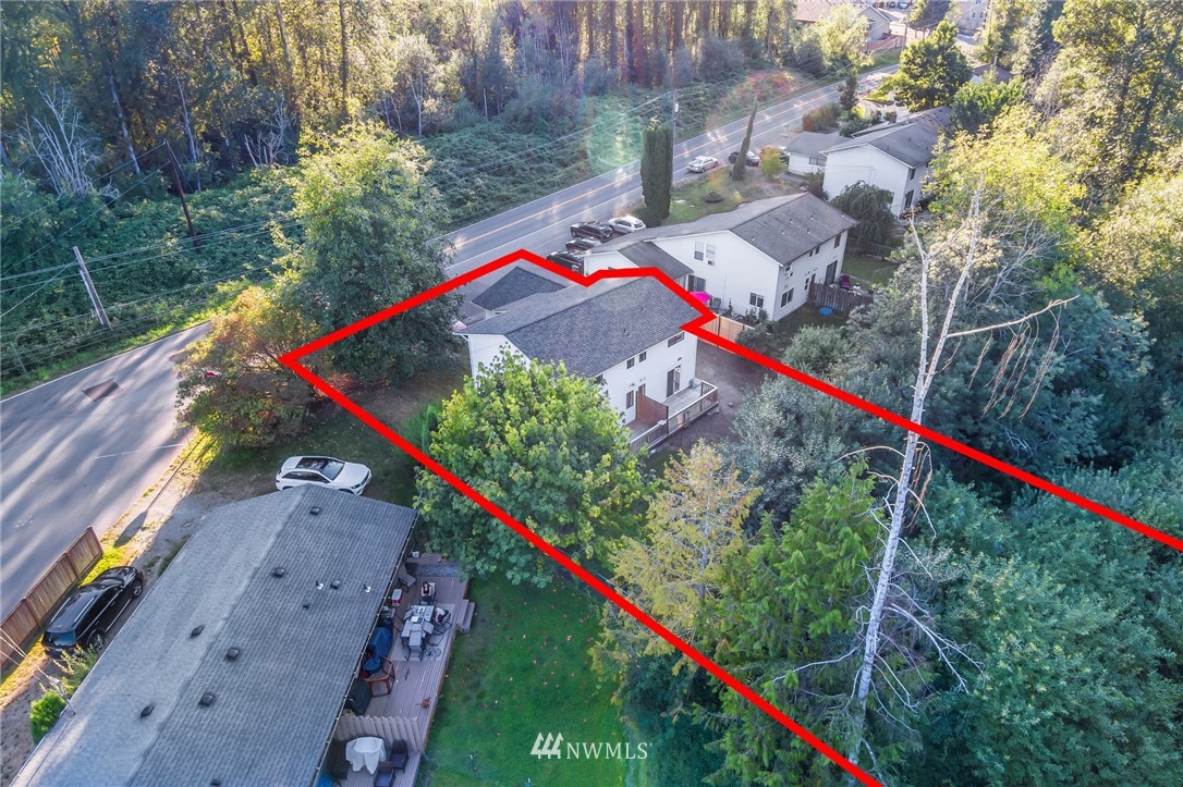 20512 Filbert Drive Bothell, WA 98012 - Photo 22 of 27 a view of swimming pool with a red and white house