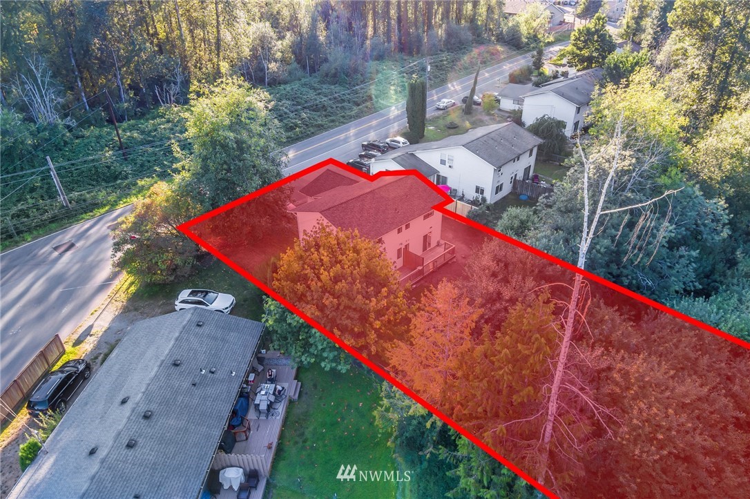 20512 Filbert Drive Bothell, WA 98012 - Photo 23 of 27 a view of a tennis ground with a large tree