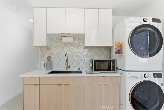 a kitchen with a washer and dryer