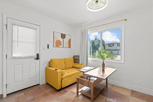 a living room with furniture and a window