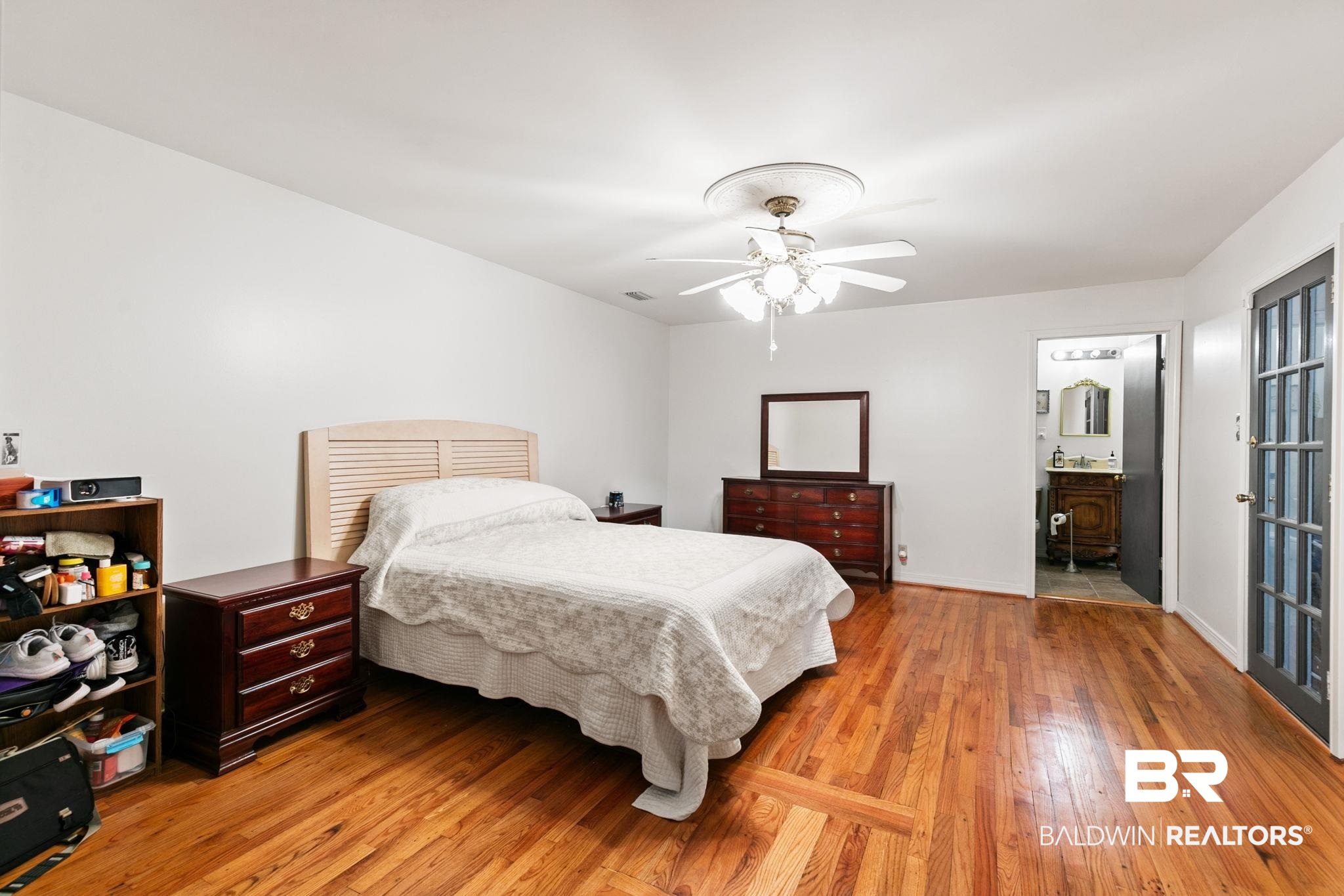 927 Cleveland Road Saraland, AL 36571 - Photo 24 of 80 Spacious room featuring wood-finish flooring, a ceiling fan with light fixture, and white wall finishes