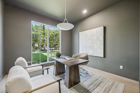 a room with furniture and a large window