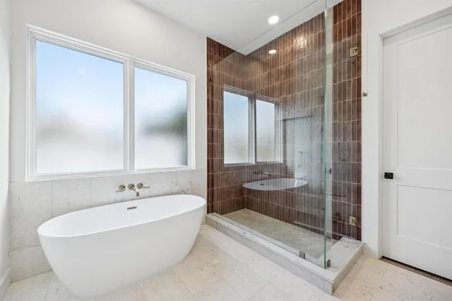 a bathroom with a bathtub and a sink