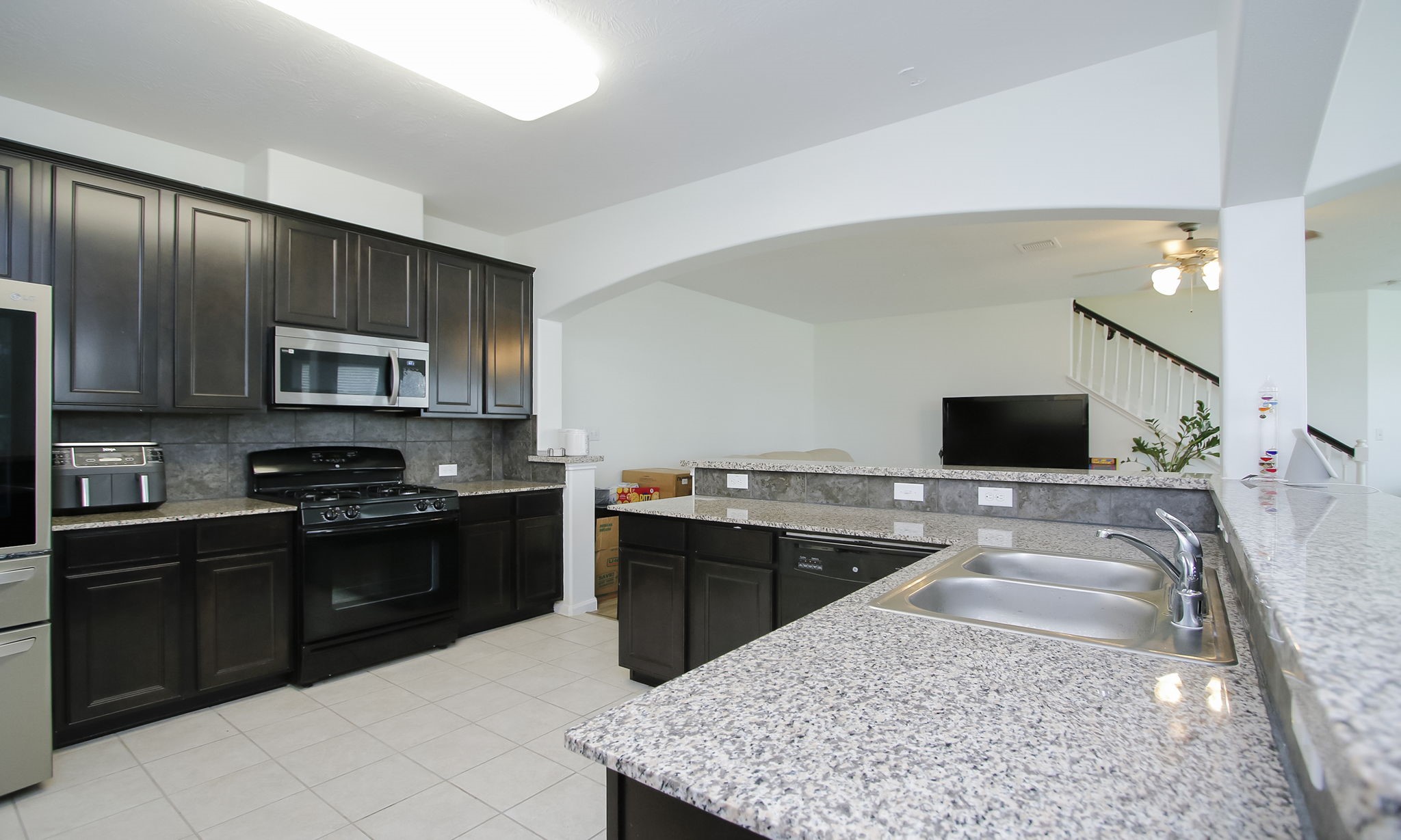 10516 Primo Place Spring, TX 77379 - Photo 11 of 34 Stainless refrigerator excluded but washer and dryer included.