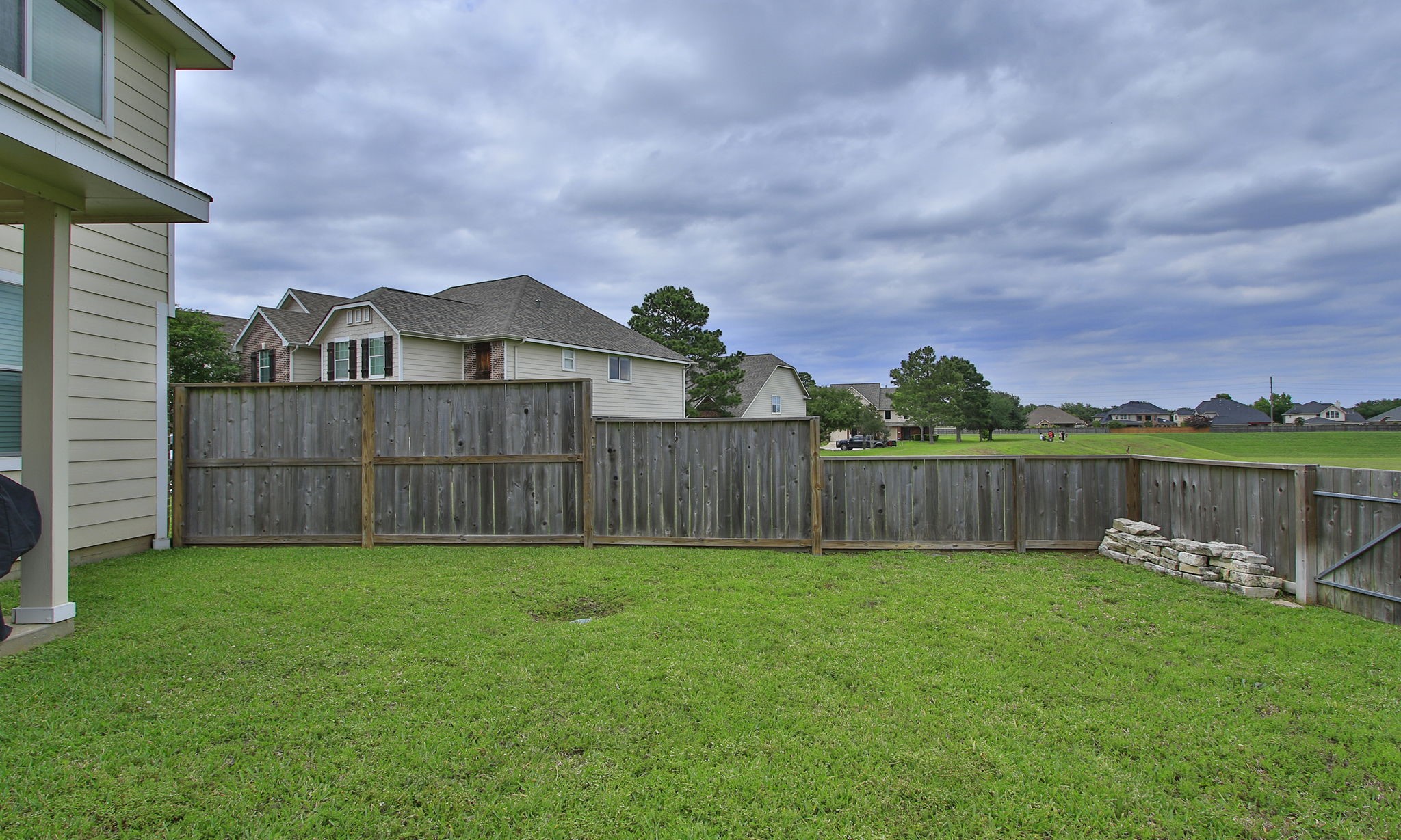 10516 Primo Place Spring, TX 77379 - Photo 29 of 34 Additional backyard view with taller section of fence.