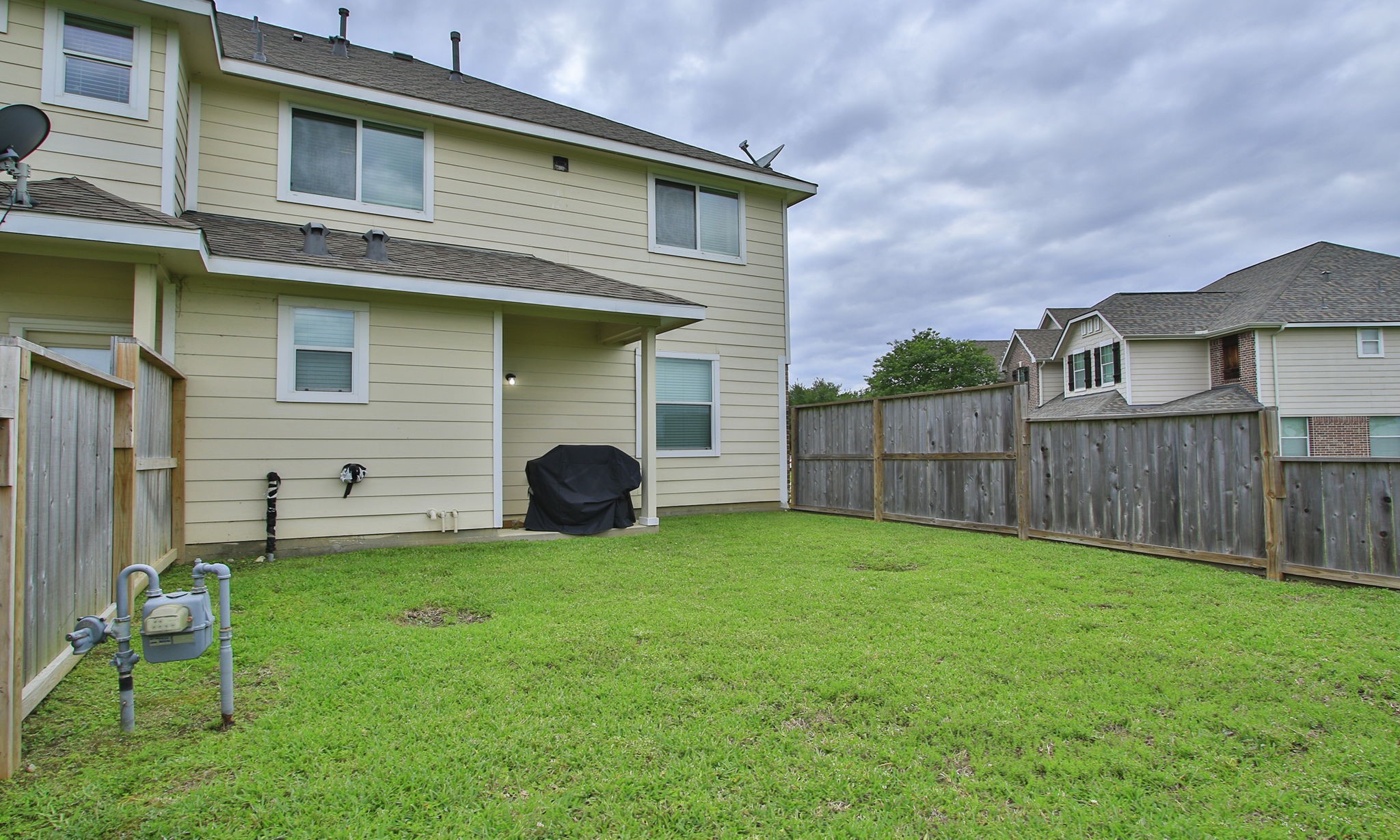 10516 Primo Place Spring, TX 77379 - Photo 30 of 34 Small covered area perfect for grilling.