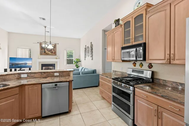 a living room with a fireplace and a window