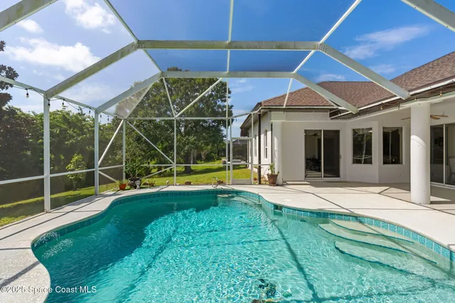 a view of a house with a yard and garage
