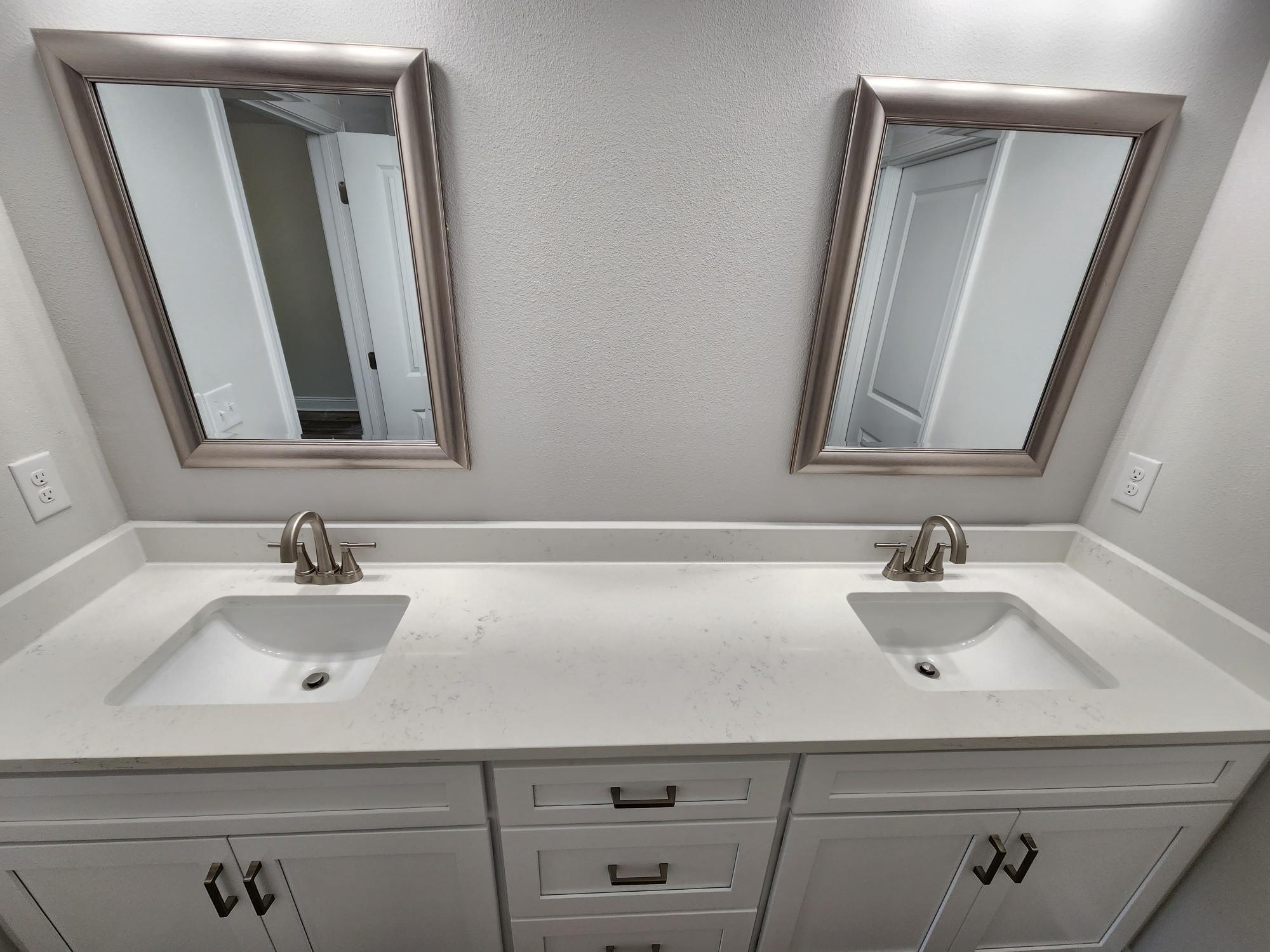 3168 Main Street Crestview, FL 32539 - Photo 12 of 18 a bathroom with a sink and a mirror
