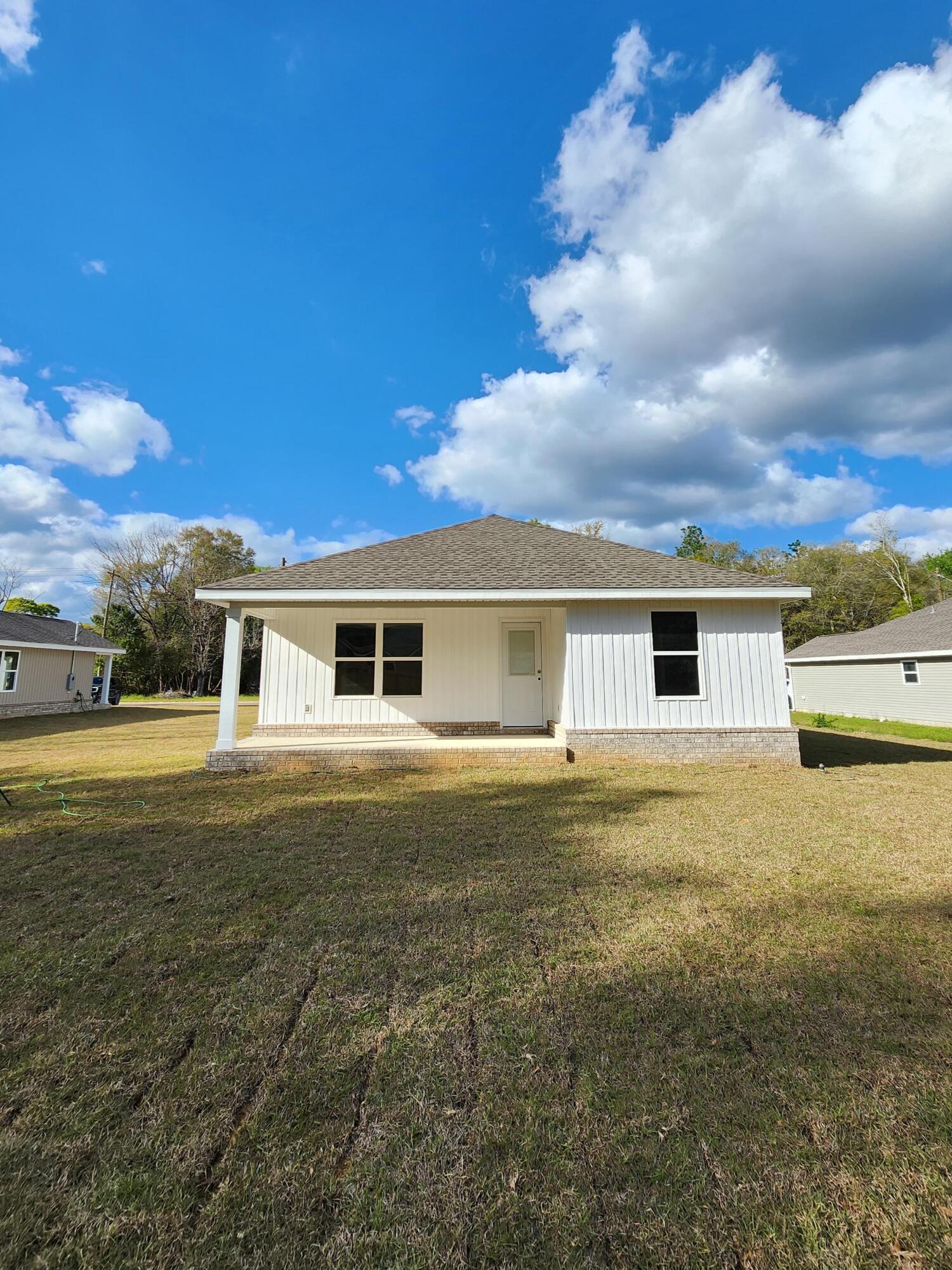 3168 Main Street Crestview, FL 32539 - Photo 3 of 18 a front view of a house with a yard