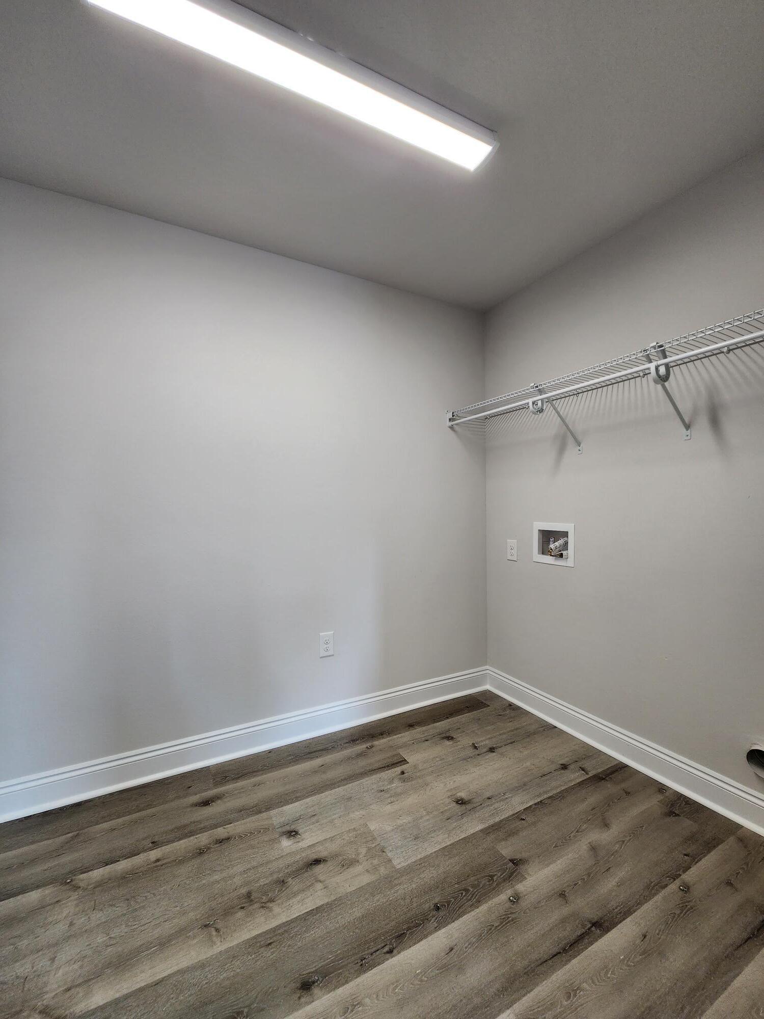 3168 Main Street Crestview, FL 32539 - Photo 8 of 18 a view of a room with wooden floor and cabinet
