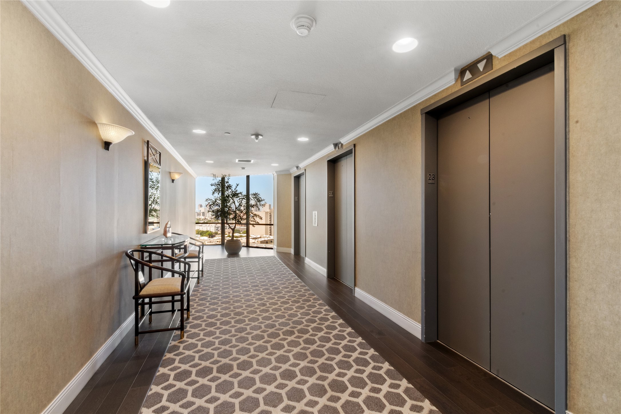 14 Greenway Plaza, Unit 23N Houston, TX 77046 - Photo 23 of 26 a view of a hallway with wooden floor and furniture