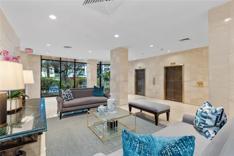 a bedroom with a bed and glass table