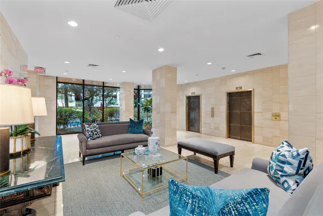 a bedroom with a bed and glass table