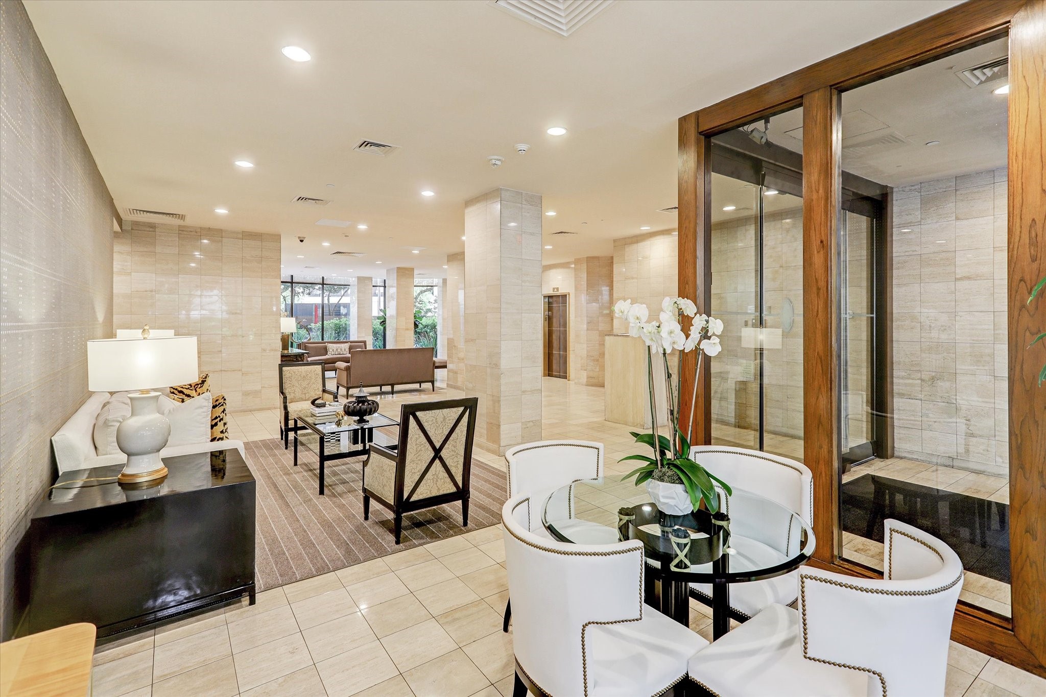 14 Greenway Plaza, Unit 23N Houston, TX 77046 - Photo 4 of 26 a dining room filled chandelier and kitchen view