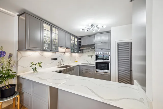 a kitchen with a refrigerator and a sink