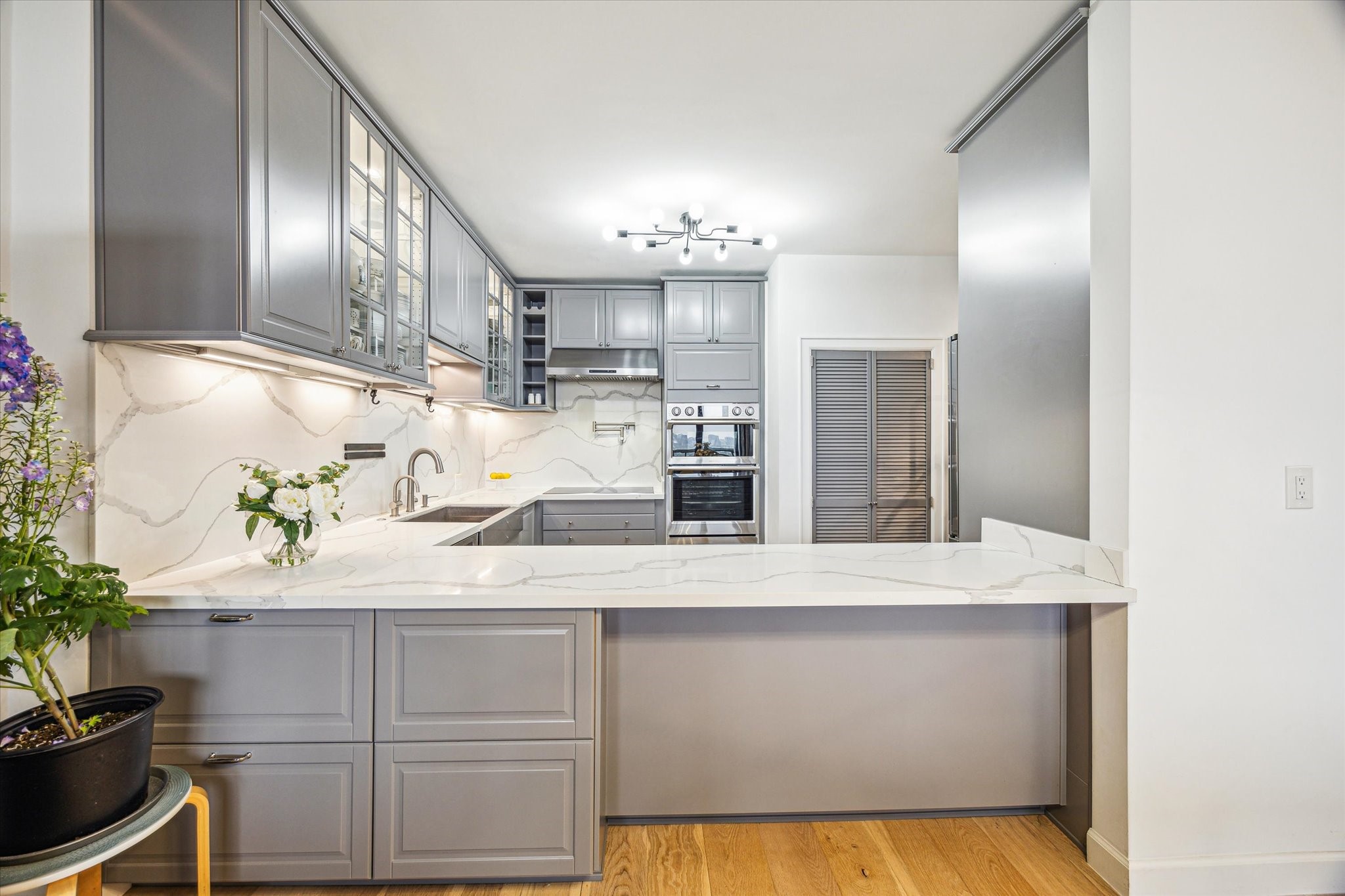 14 Greenway Plaza, Unit 23N Houston, TX 77046 - Photo 8 of 26 a kitchen with kitchen island a counter top space cabinets and stainless steel appliances
