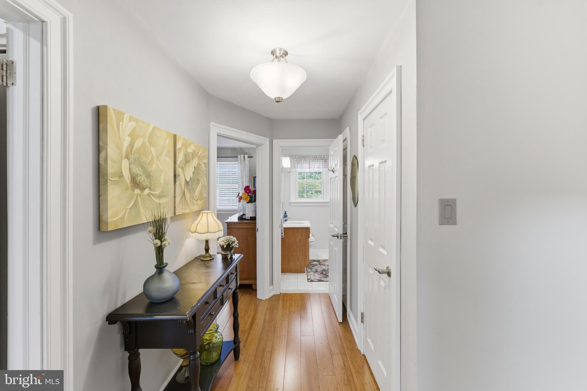 447 Maddock Road Springfield, PA 19064 - Photo 17 of 42 a view of a hallway with workspace and wooden floor