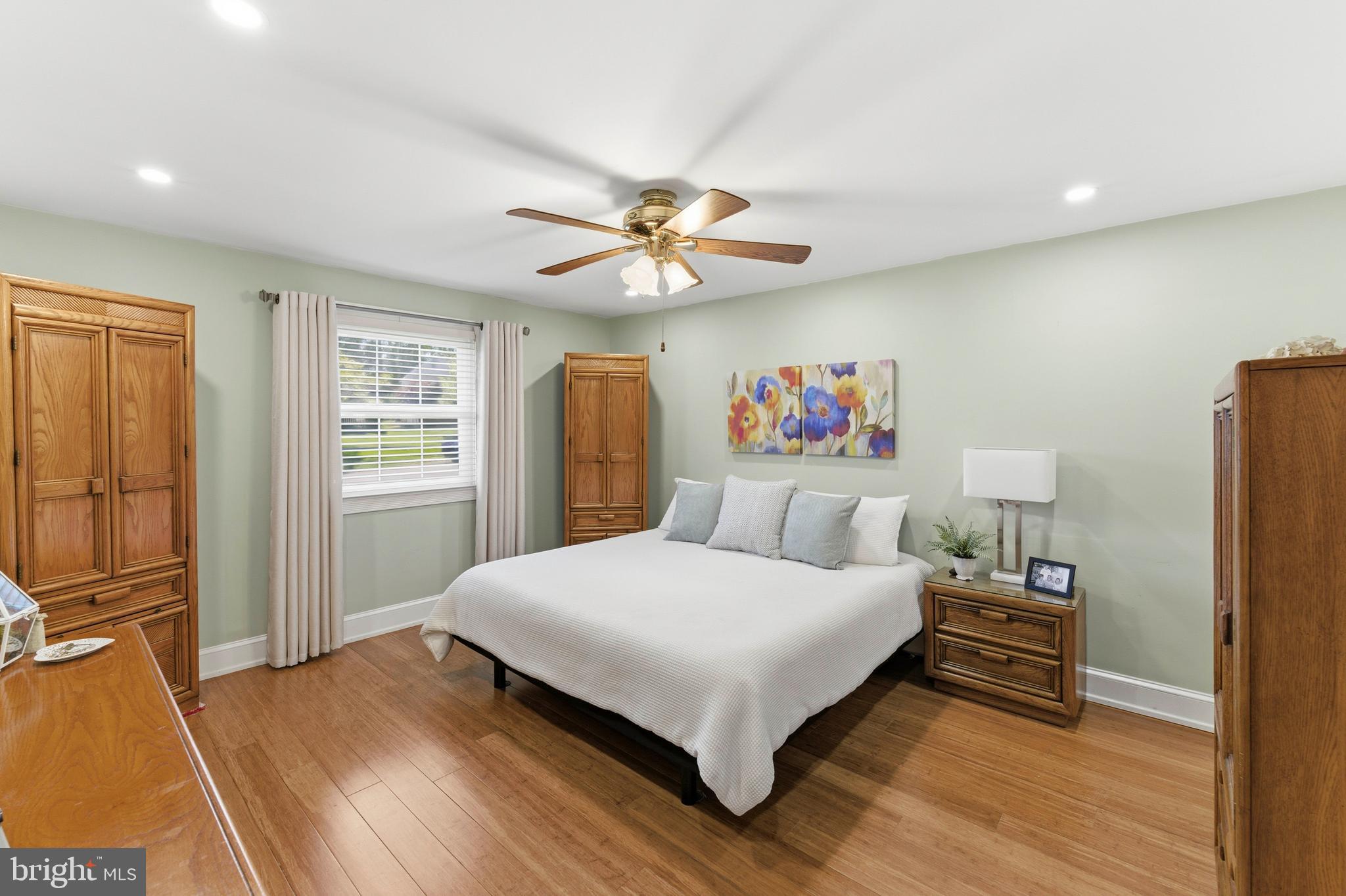 447 Maddock Road Springfield, PA 19064 - Photo 18 of 42 a bedroom with a bed and a chandelier