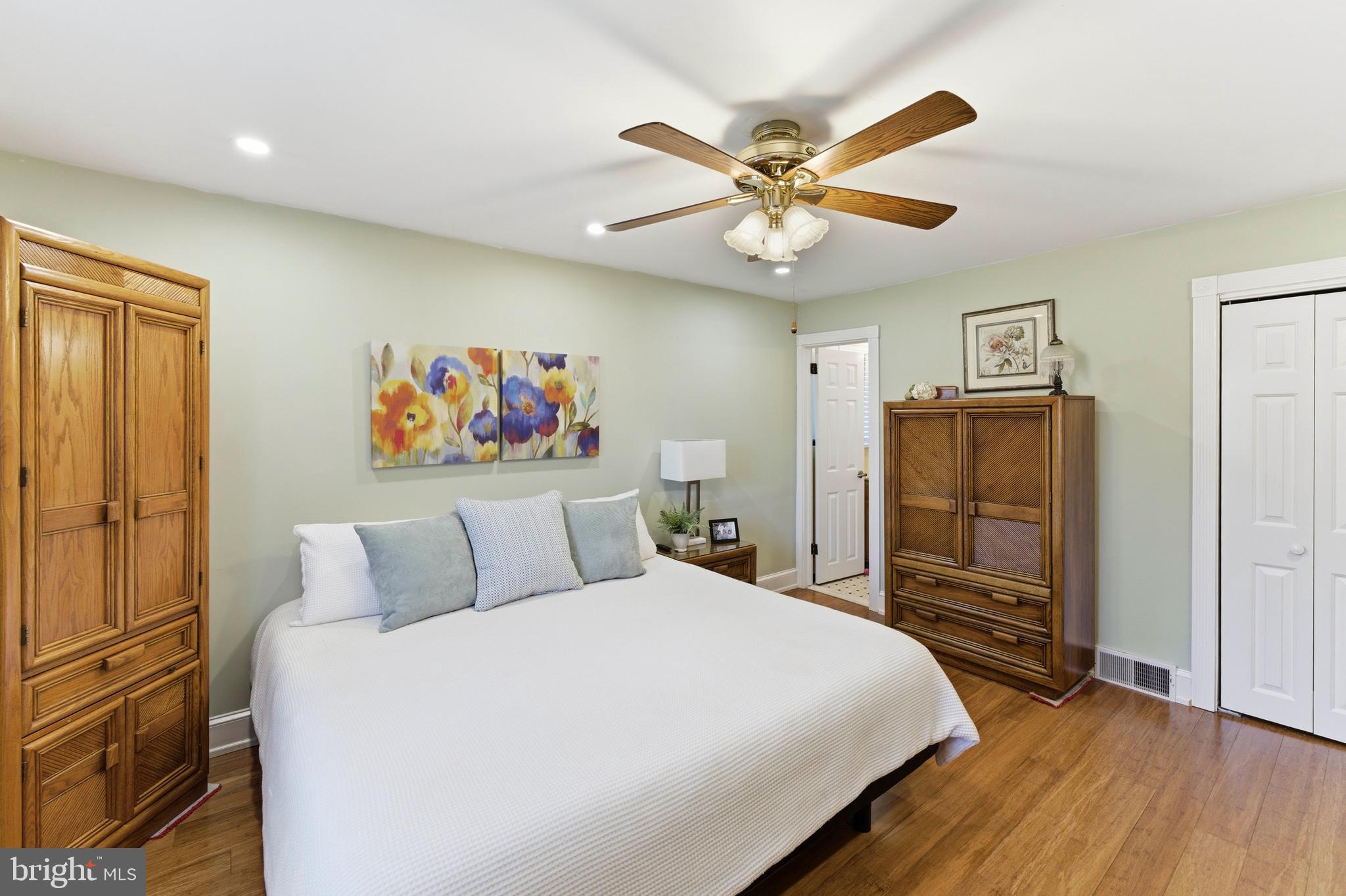 447 Maddock Road Springfield, PA 19064 - Photo 19 of 42 a bedroom with a bed and a chandelier