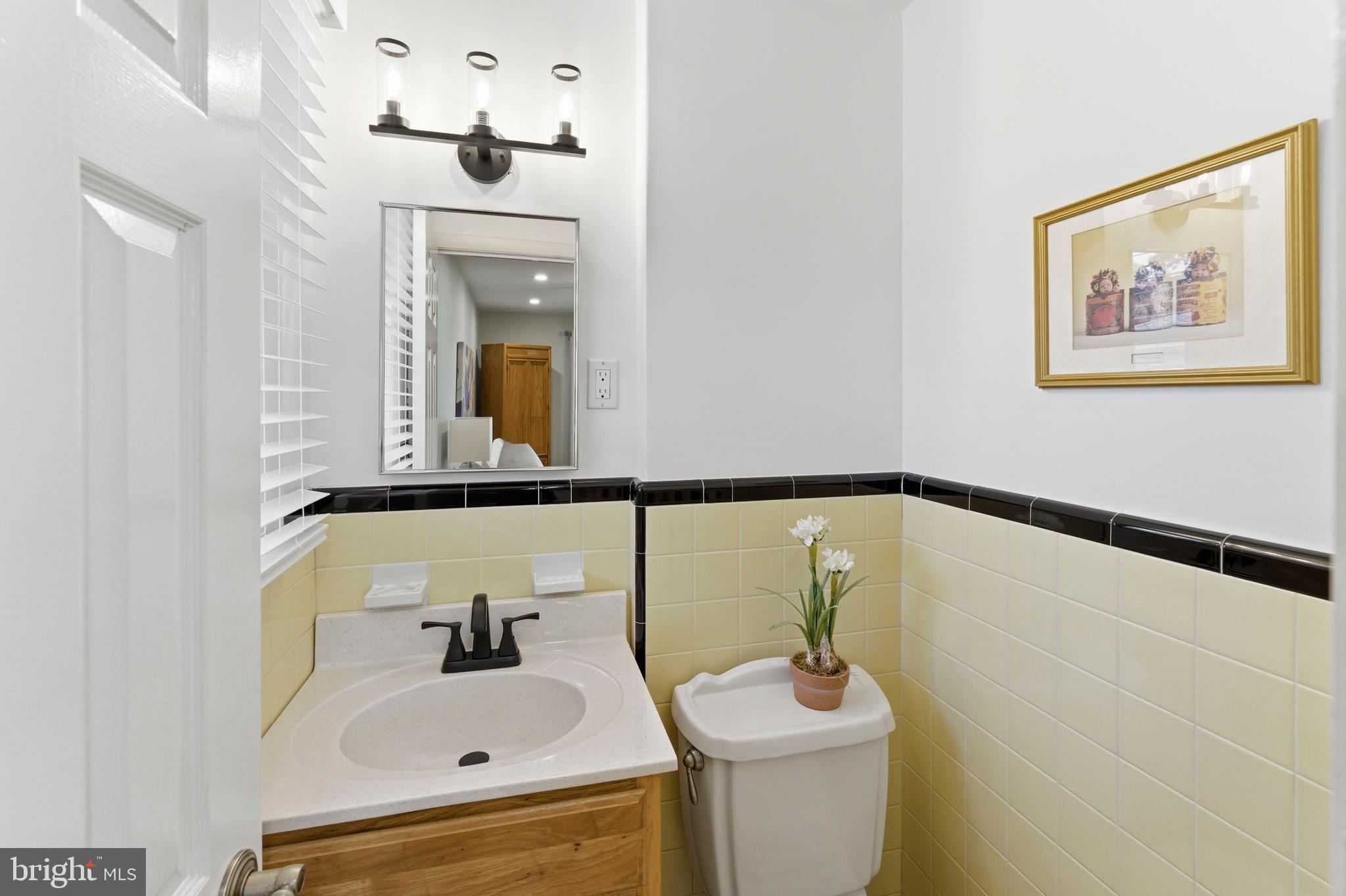 447 Maddock Road Springfield, PA 19064 - Photo 21 of 42 a bathroom with a sink and mirror with toilet