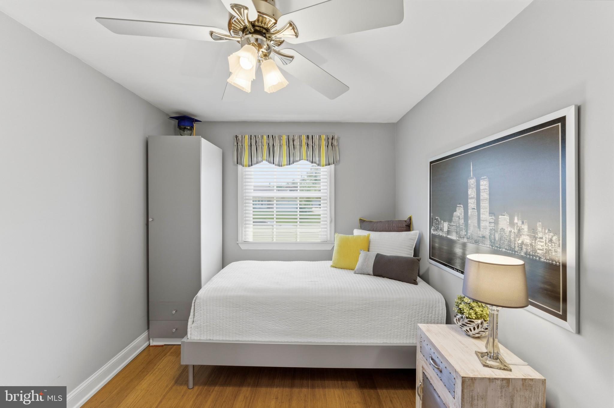 447 Maddock Road Springfield, PA 19064 - Photo 22 of 42 a bedroom with a large bed and a chandelier