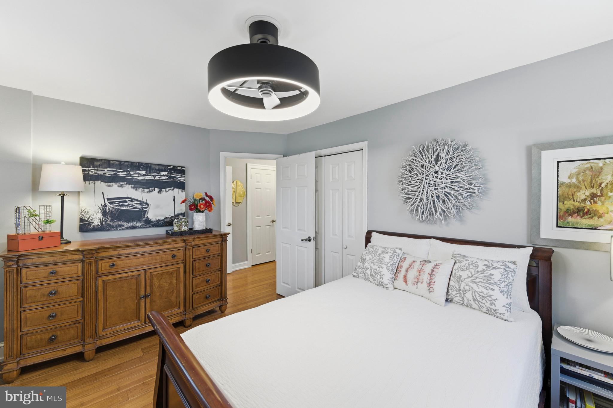 447 Maddock Road Springfield, PA 19064 - Photo 24 of 42 a bedroom with a bed and a chandelier