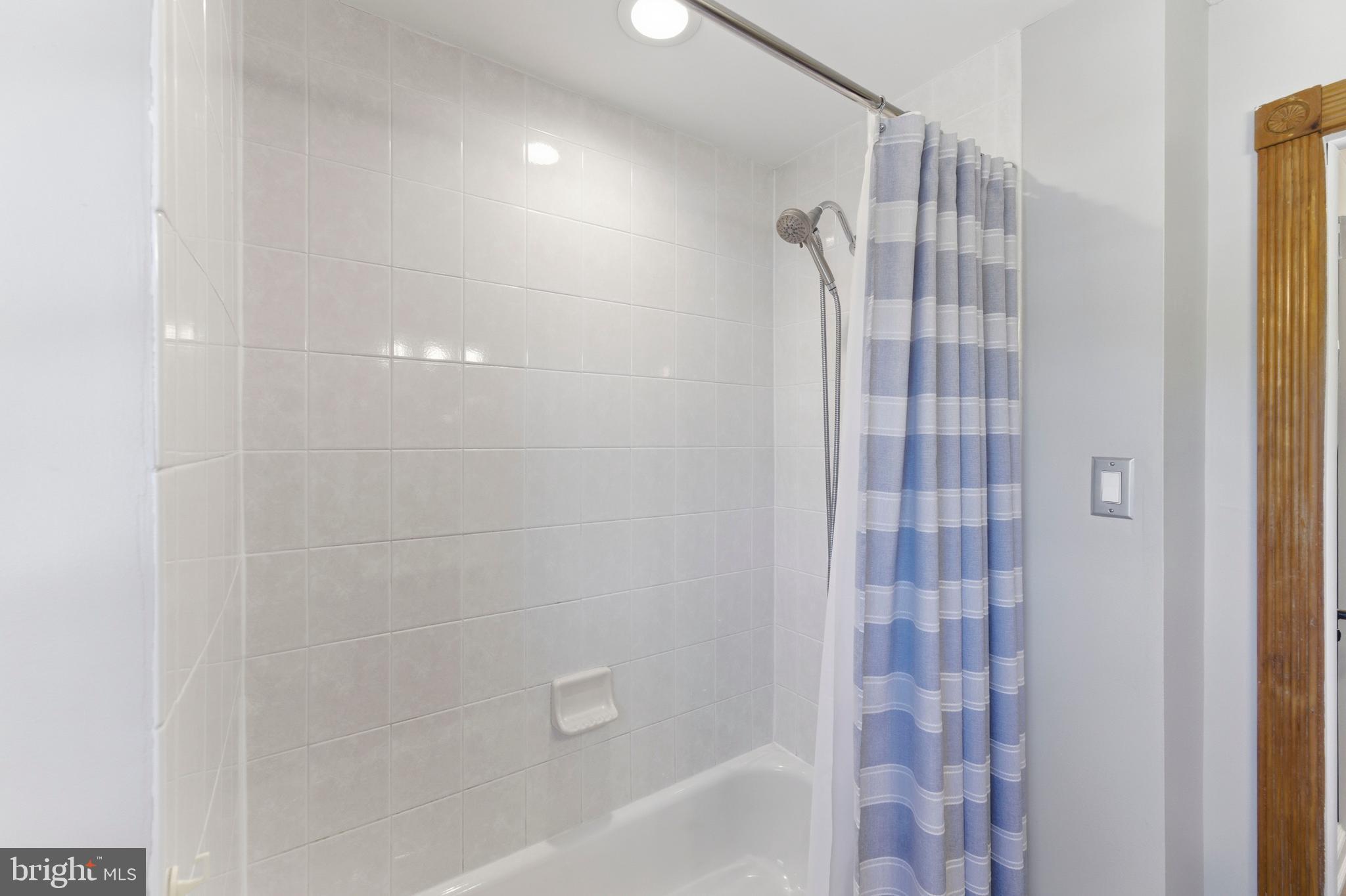 447 Maddock Road Springfield, PA 19064 - Photo 26 of 42 a bathroom with a shower curtain and a sink