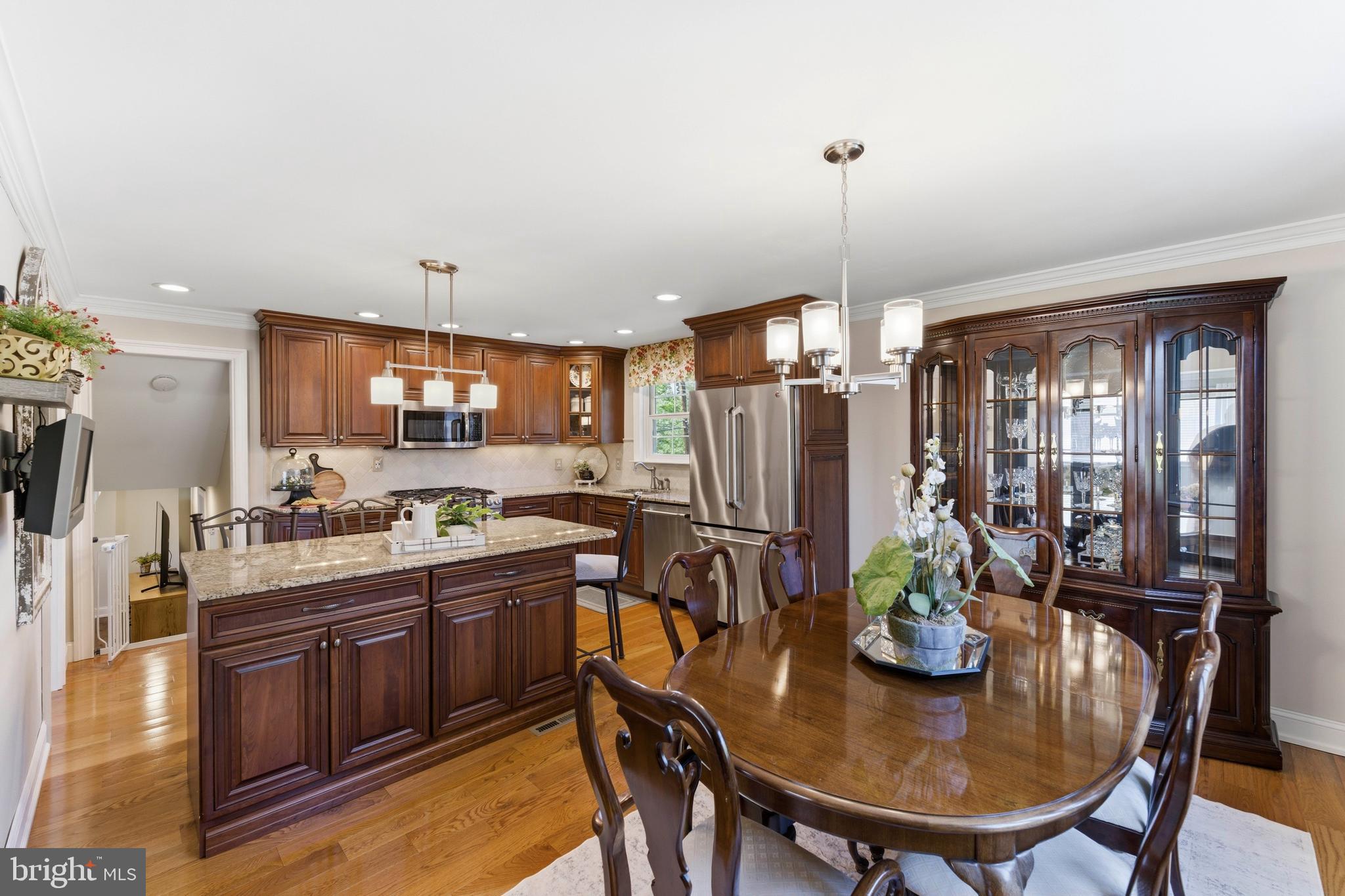 447 Maddock Road Springfield, PA 19064 - Photo 10 of 42 a kitchen with sink a refrigerator and chairs