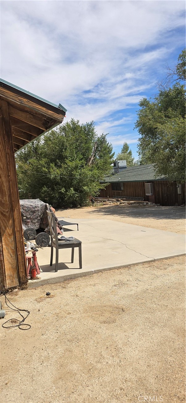 308 East Ave R8 Palmdale, CA 93550 - Photo 5 of 19 a view of a swimming pool with an outdoor seating