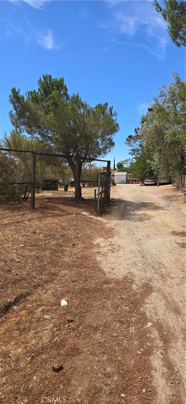 308 East Ave R8 Palmdale, CA 93550 - Photo 8 of 19 a backyard of a house with table and chairs