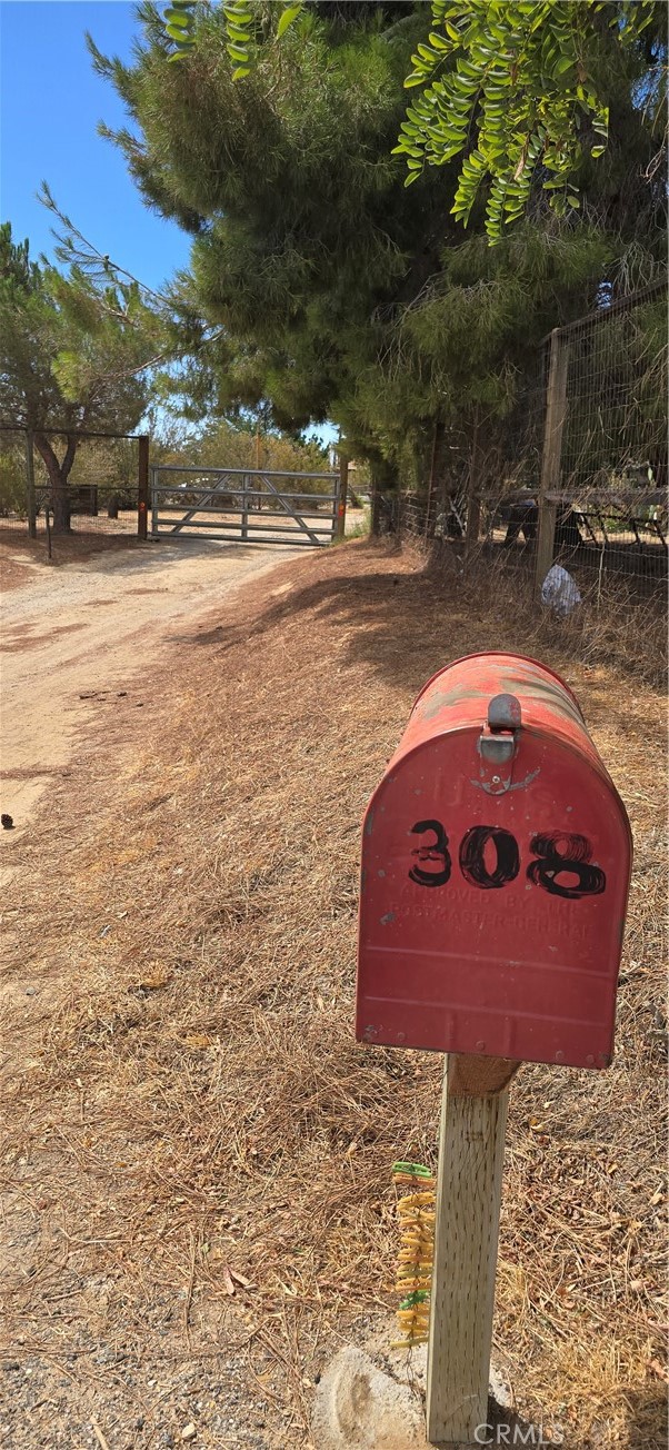 308 East Ave R8 Palmdale, CA 93550 - Photo 9 of 19 a front view of a house with a yard and garage