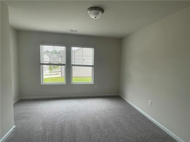 a view of a back yard of the house