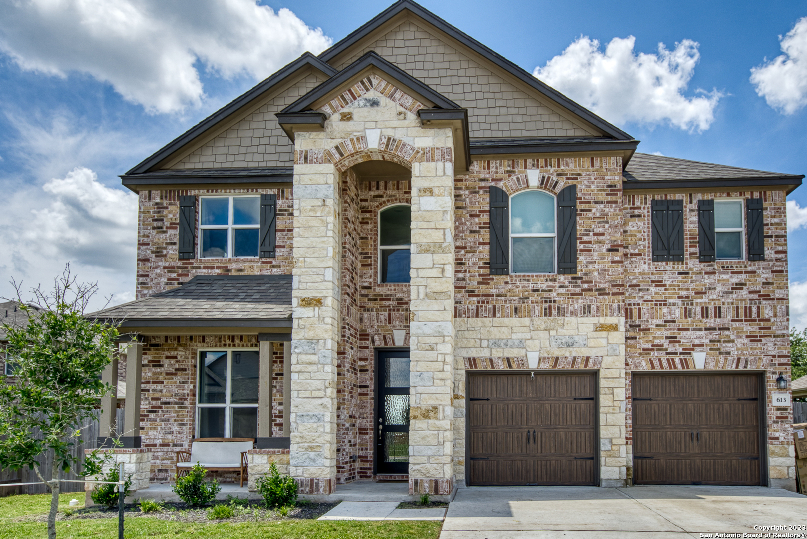 a front view of a house with yard