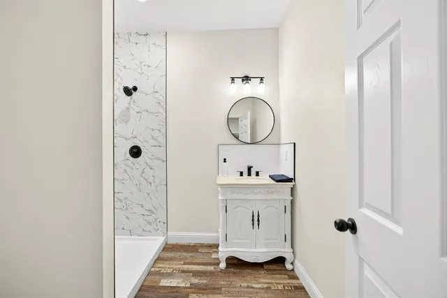 a bathroom with a shower and toilet