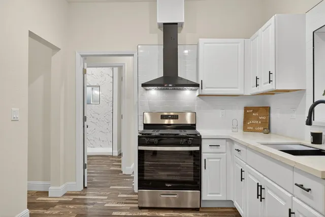 a kitchen with a sink and cabinets