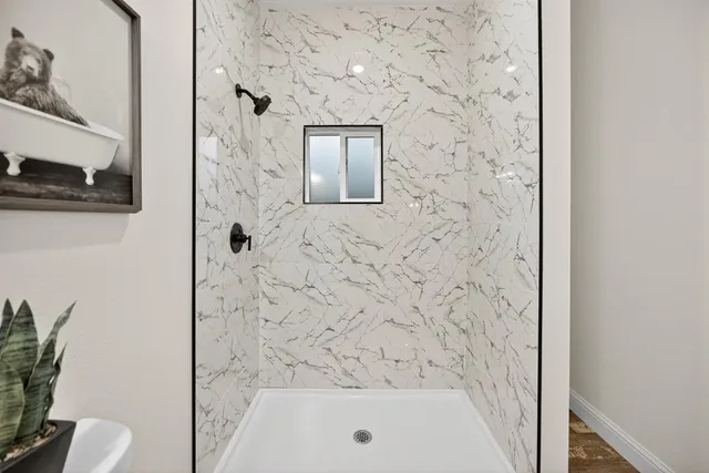 a view of front of a house with a large window