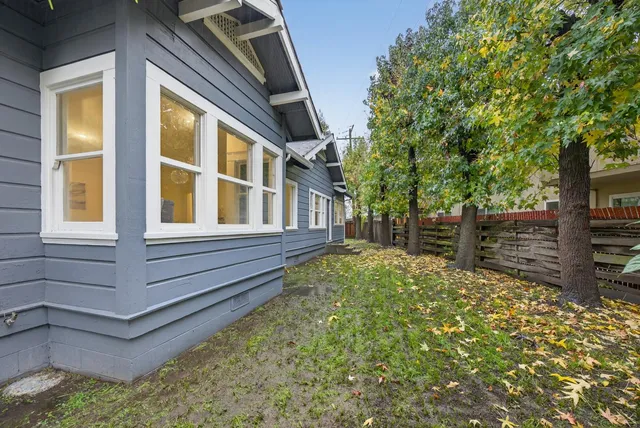 a view of a house with a tree