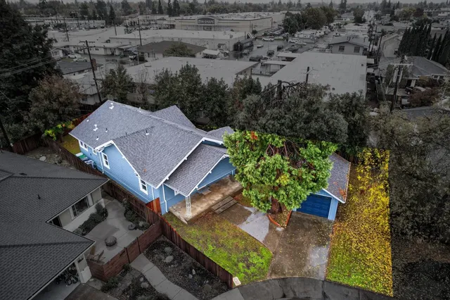 an aerial view of residential houses with outdoor space