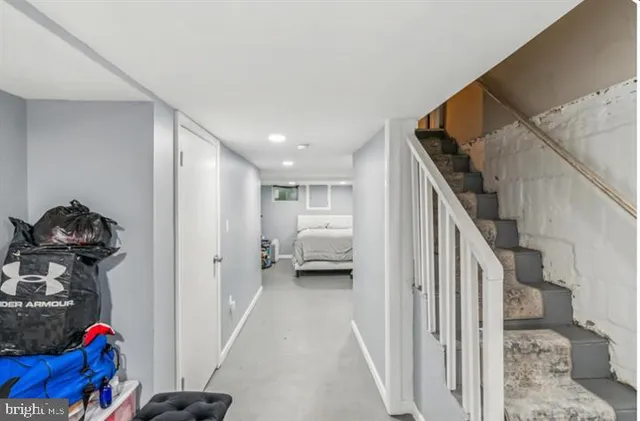 a bedroom with a bed and a tv