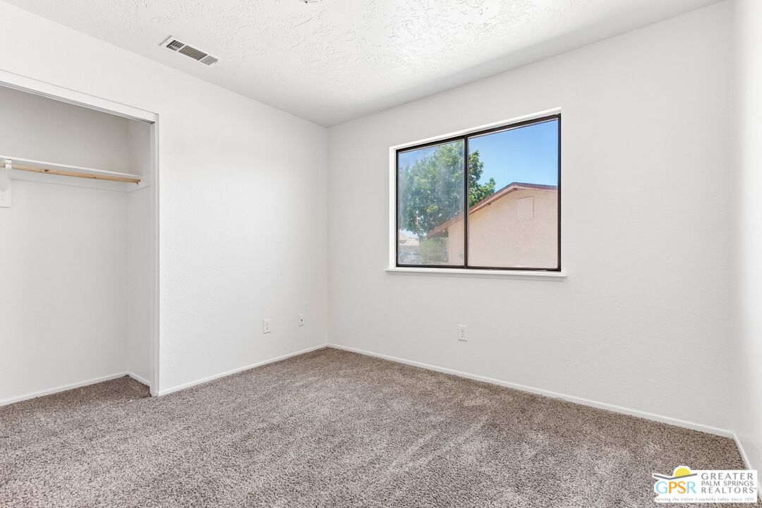 13819 Rivers Edge Road Helendale, CA 92342 - Photo 15 of 31 a view of an empty room with a window