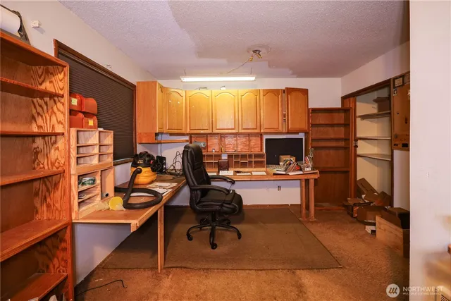 a view of a workspace with furniture