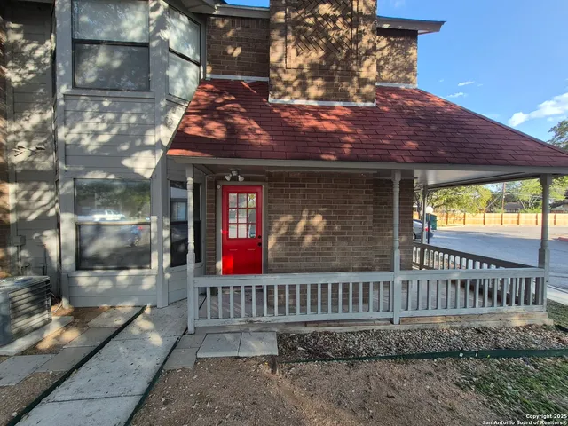 a view of a porch with a bench