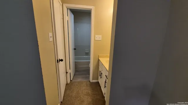 a bathroom with a toilet and a sink