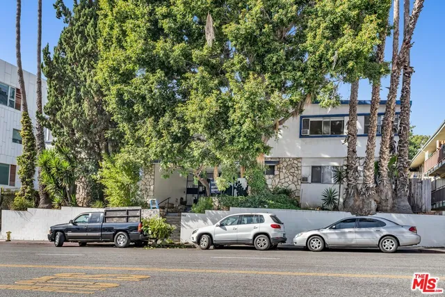 a cars parked in front of a house
