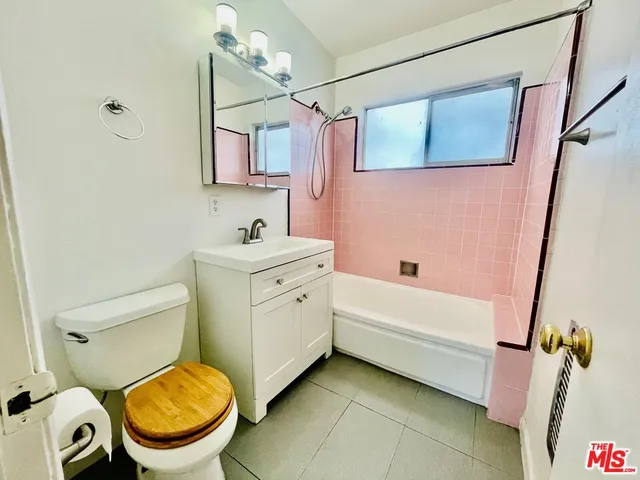 a bathroom with a sink a toilet and bathtub